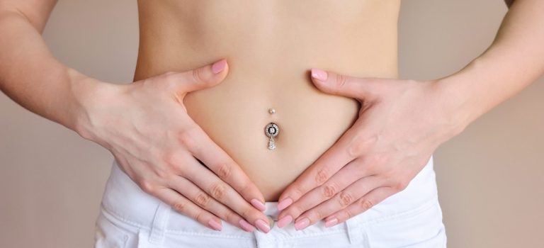 woman-holding-hands-on-a-belly-stomach-health-P84SMZN